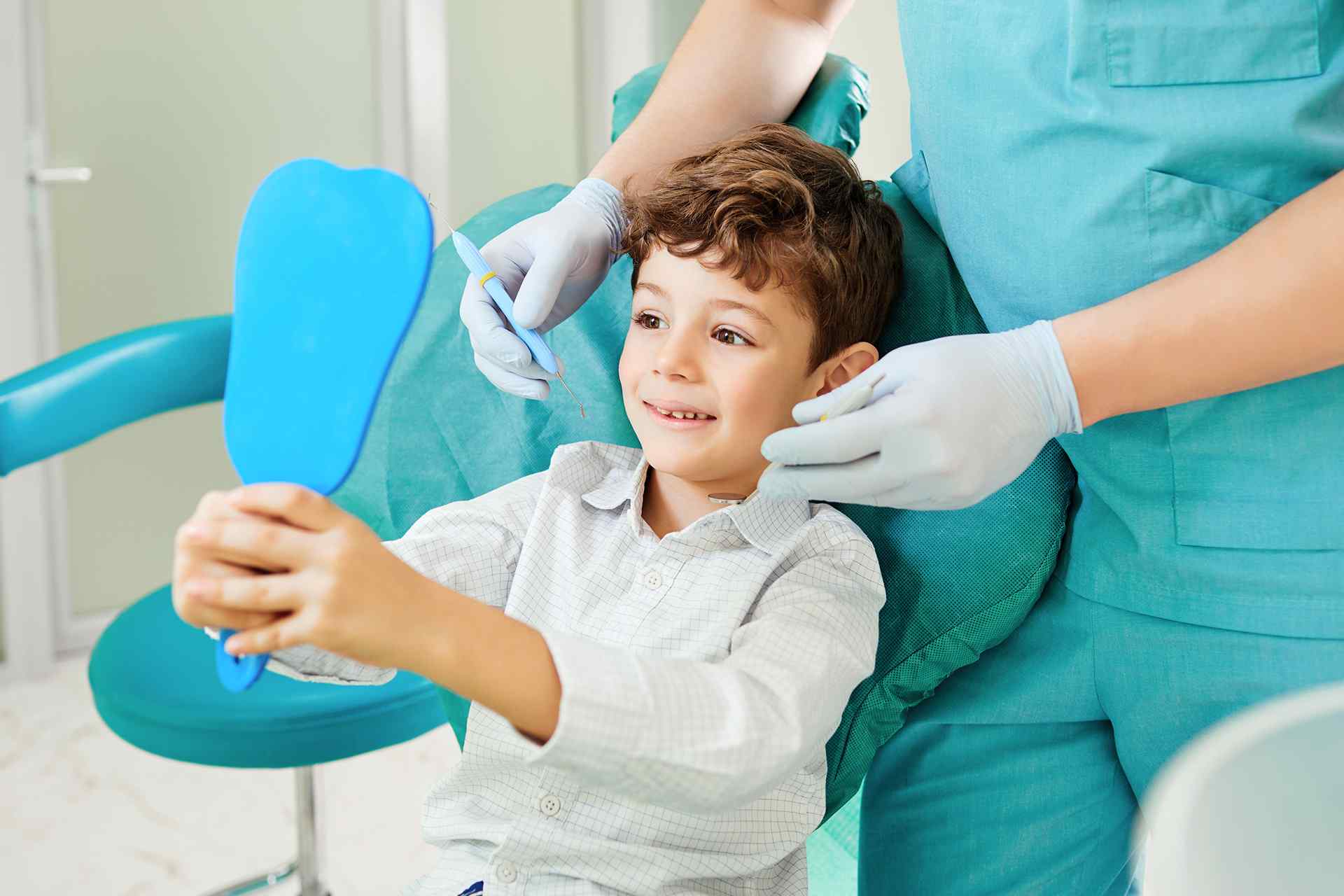 Boy sitting on dental chair