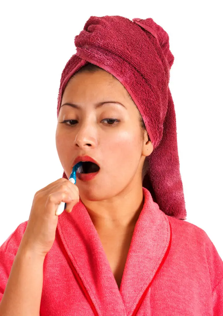 Woman Brushing Her Teeth